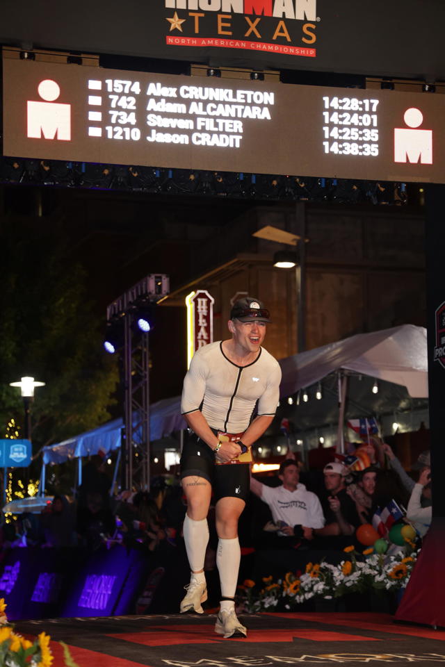 Alex Crunkleton crossing the Ironman Texas finish line